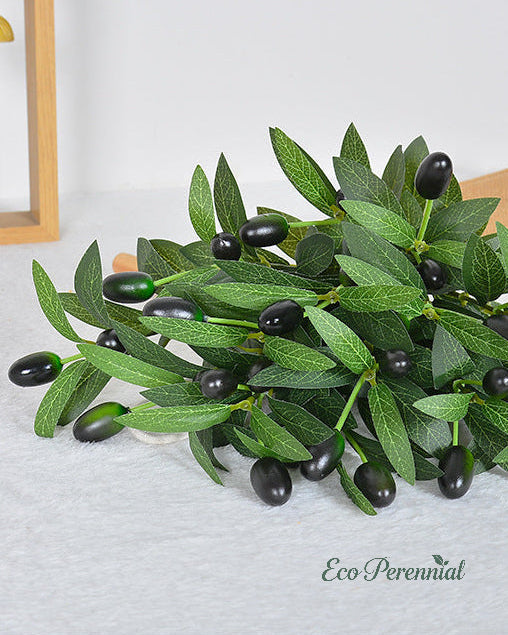 Artificial olive branches styled on kitchen island by Eco Perennial