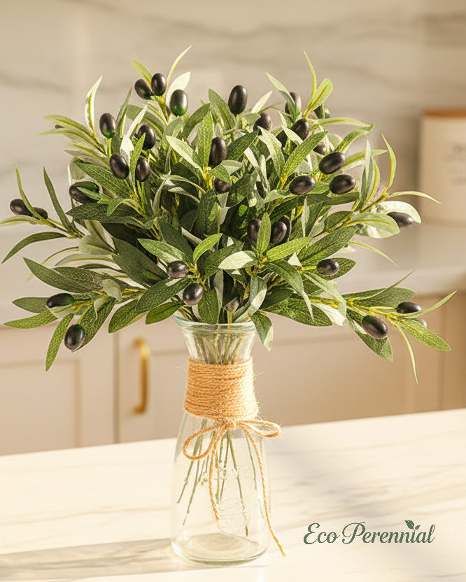 Artificial olive greenery centerpiece on marble counter by Eco Perennial