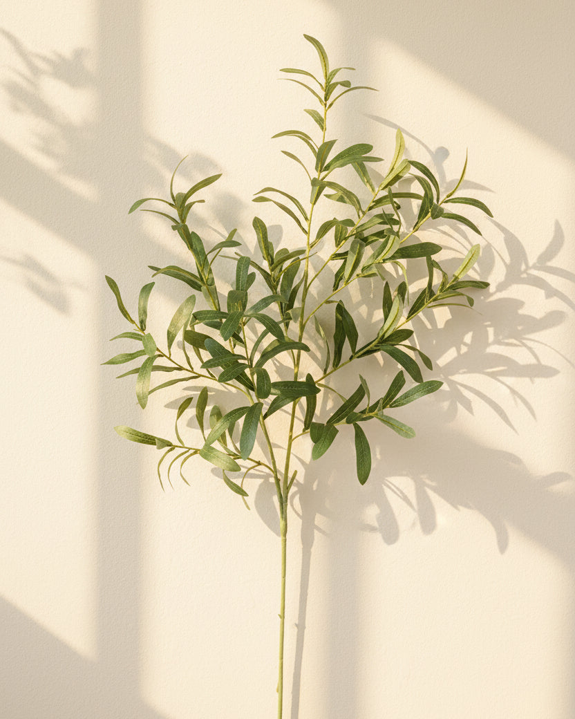 Eco Perennial 10-fork faux olive branch with dense dark green leaves on a clean off-white background, 102cm artificial olive stem product photo