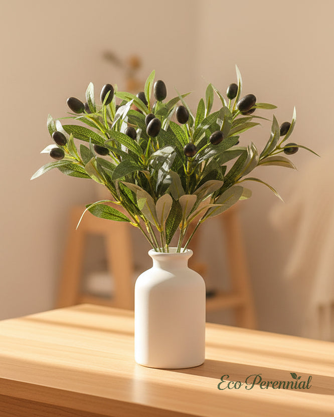 Faux olive branches arranged on modern entryway console by Eco Perennial