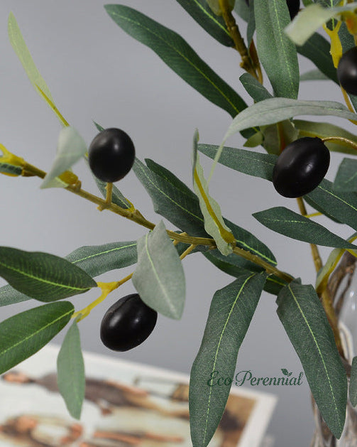 Realistic artificial olive branches arranged in ceramic vase by Eco Perennial