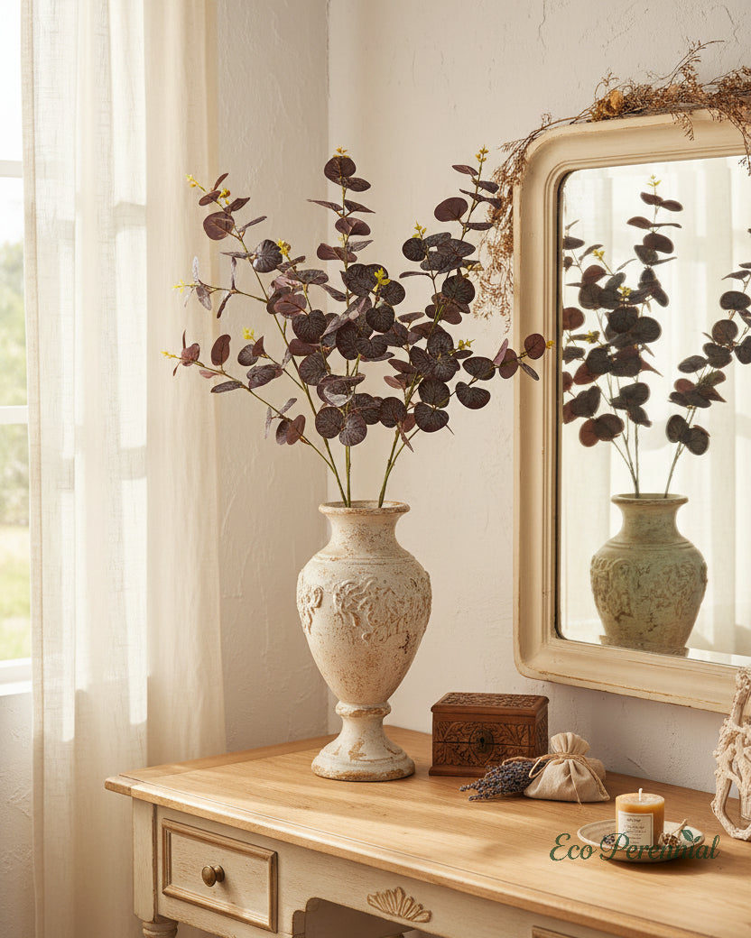 Rust brown faux eucalyptus branches in a vase on a light neutral bedroom vanity - Eco Perennial