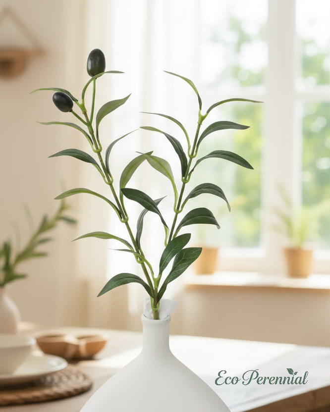 Short faux olive branches styled on dining table by Eco Perennial