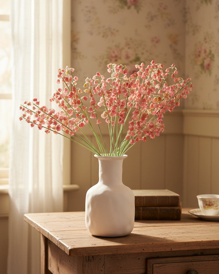 Soft pink faux lily of the valley bell flower stems in ceramic vase - Eco Perennial
