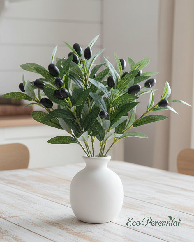Tabletop arrangement of short artificial olive branches by Eco Perennial