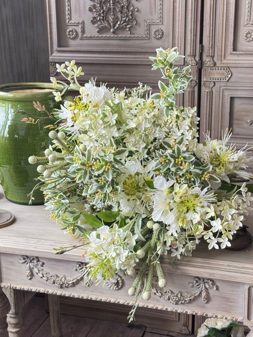 Close-up of high-quality silk rose petals and mixed botanical textures, showing the realistic craftsmanship of our hand-tied bouquet.