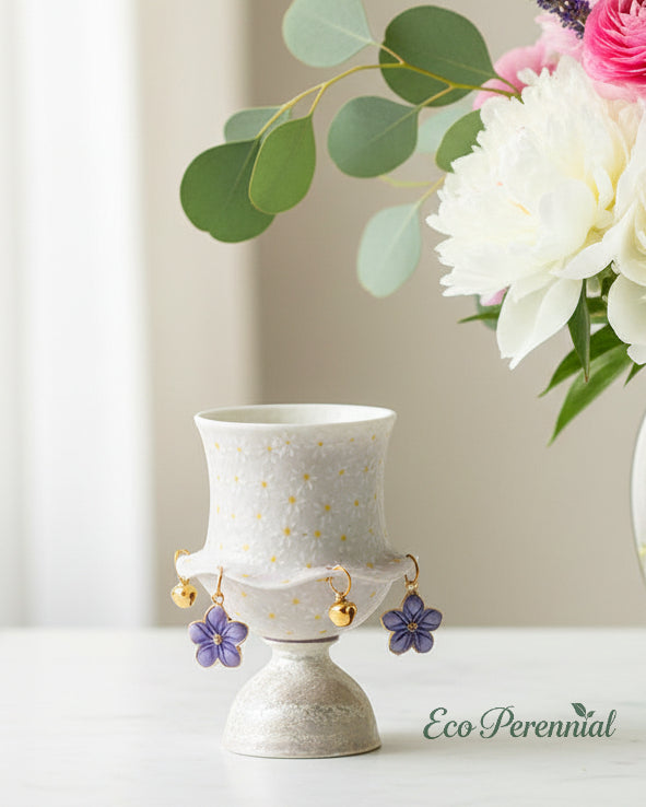 Lavender ceramic tea cup beside fresh flower vase home decor — Eco Perennial